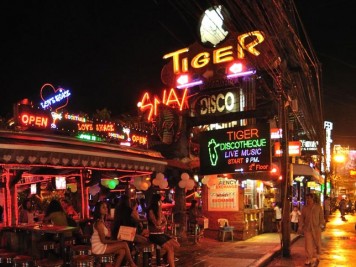 Tiger Disco on Bangla Road in Patong City at night with neon lights and bar girls.